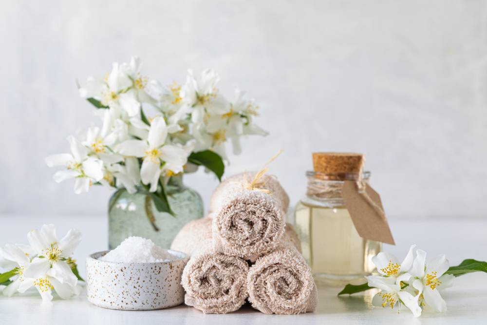 spa concept jasmine oil with bath salt flowers 1